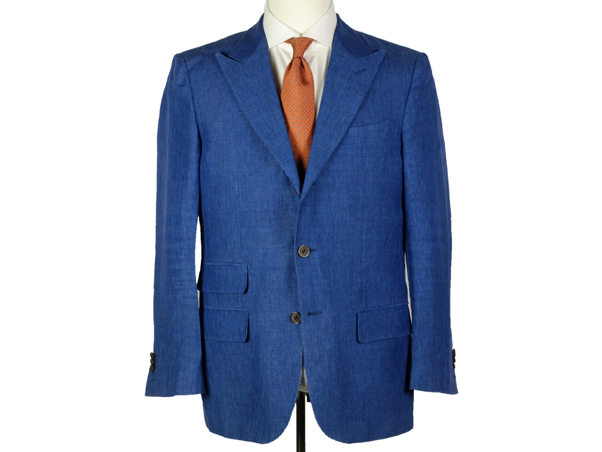 Blue suit jacket with a white shirt and orange tie on a mannequin against a white background